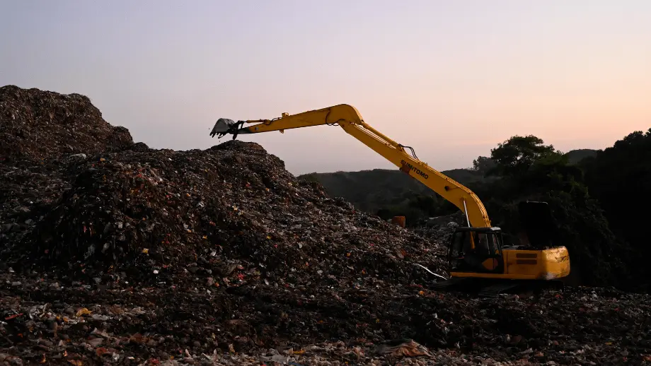 Digger in waste