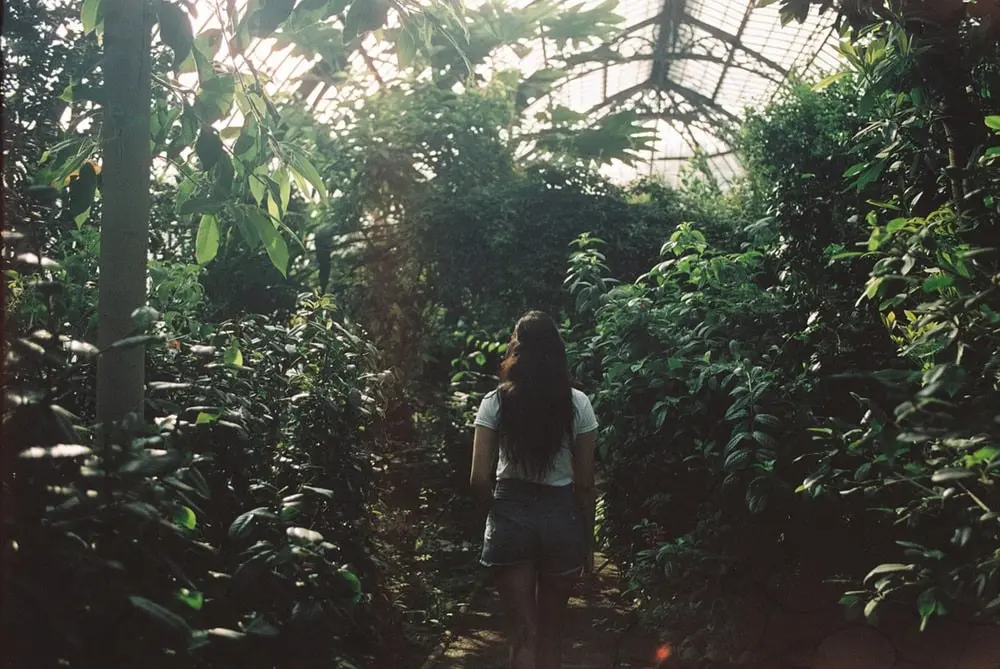 Girl in greenhouse